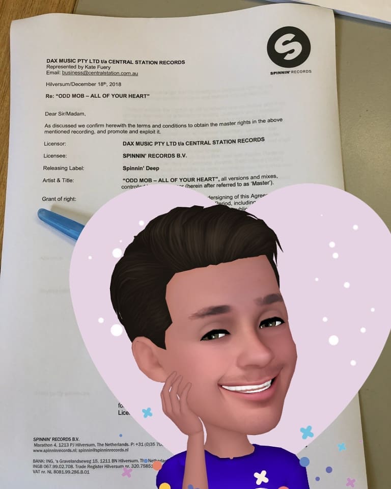 A Spinnin Records contract for All Of Your Heart with a celebrating memoji over it