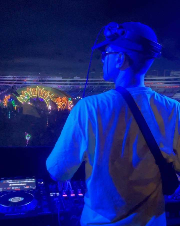 Odd Mob behind the decks at EDC Las Vegas, bathed in blue light above a glowing main stage