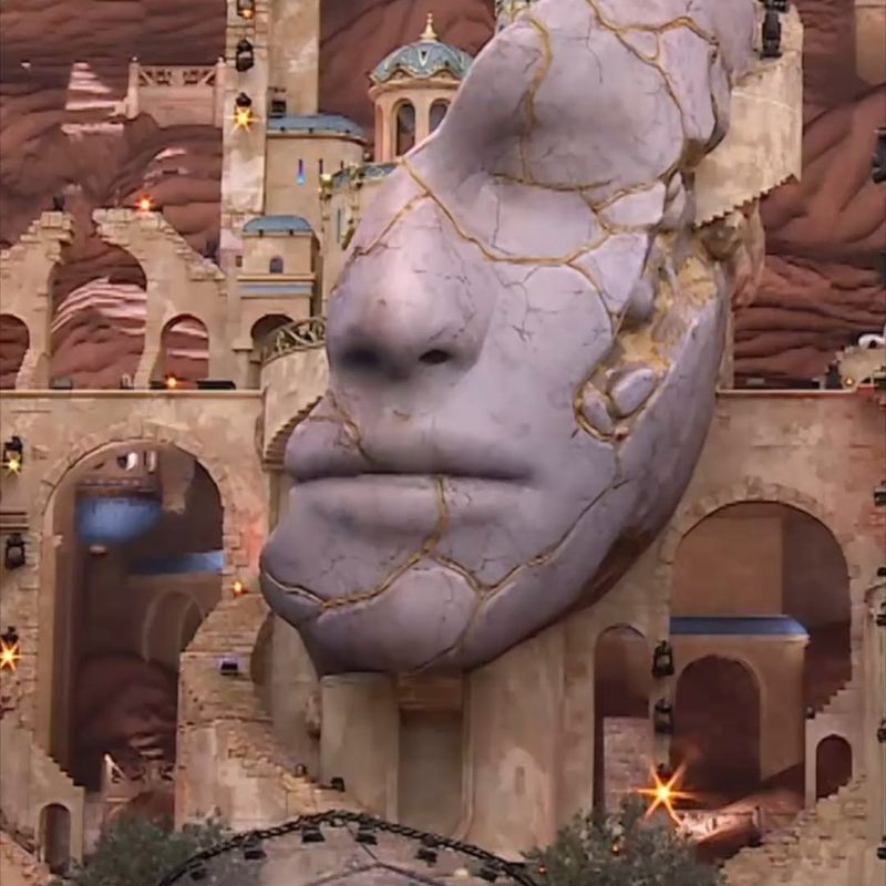 The giant carved stone face of the Tomorrowland 2026 main stage